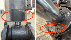 Hydrauliken an einem Bagger mit Flüssigkeitsaustritt